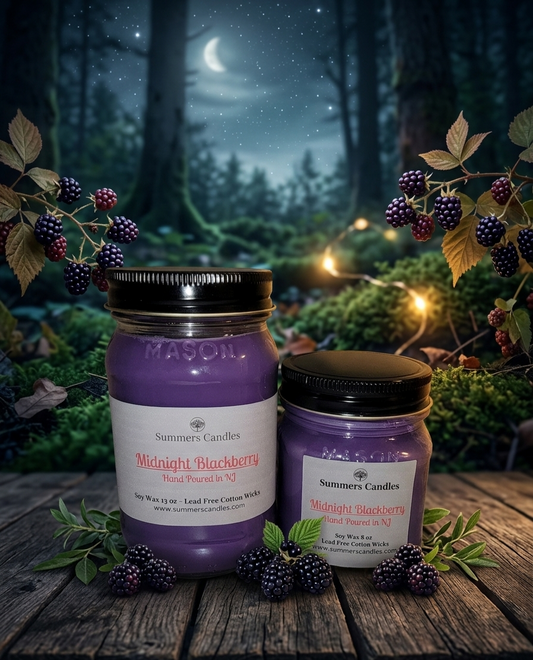 Two jars of 'Midnight Blackberry' candles on a wooden surface with a forest background.